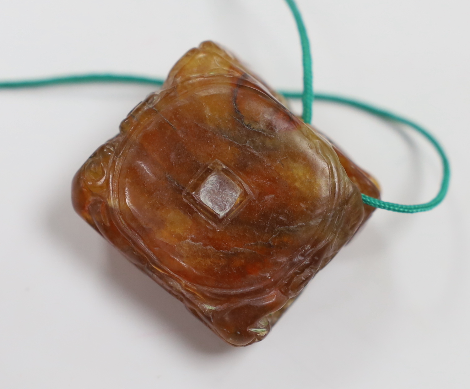 A Chinese chalcedony 'bats and lingzhi' carving , Qing dynasty, 3.5cm